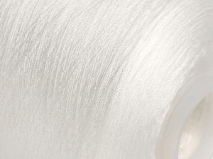 Close-up of white yarn wound on a spool, showing fine fibers and texture.