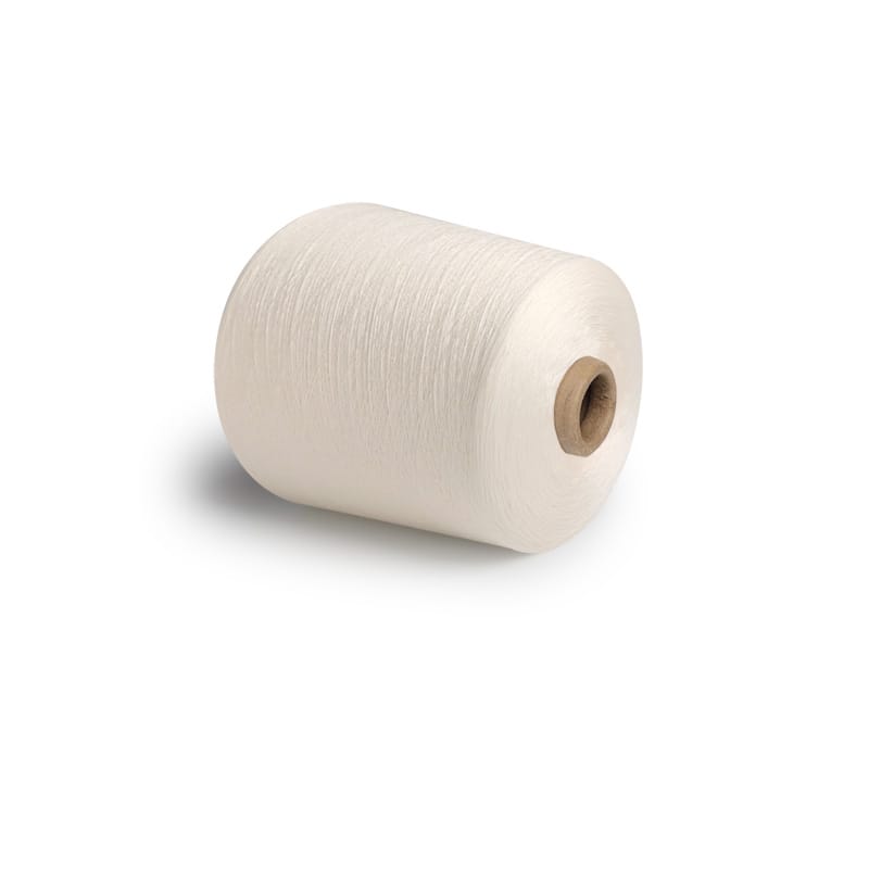 White spool of thread on a white background with a brown core visible at the center