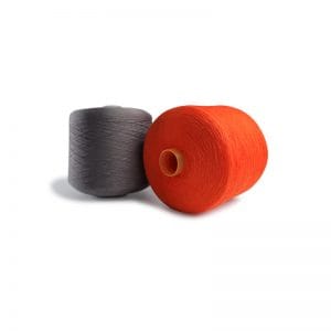 Two thread spools, one gray and one bright orange, resting on a white background with a soft shadow.
