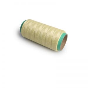 Cream-colored spool of sewing thread on a cardboard core with teal ends.