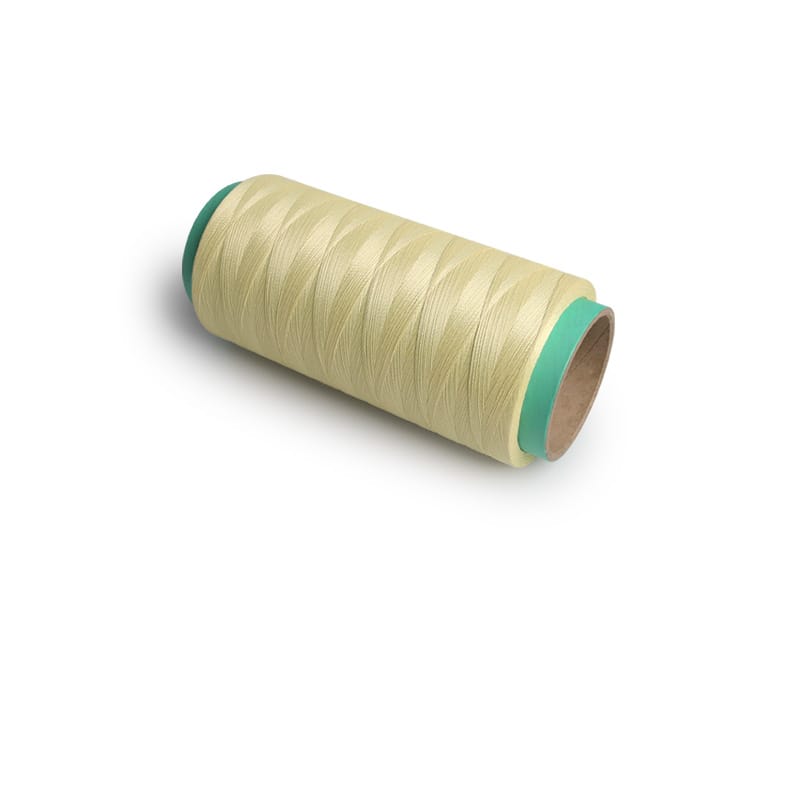Cream-colored spool of sewing thread on a cardboard core with teal ends.