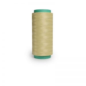 Beige spool of sewing thread with teal caps on a white background
