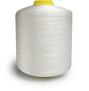 Large white thread spool with a yellow cap resting on a light surface.