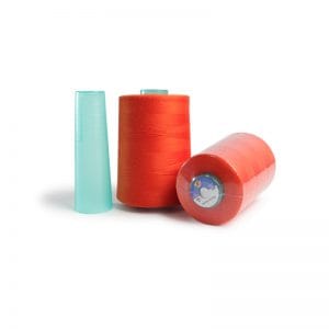 Three spools of sewing thread in turquoise, orange, and red on a white background.