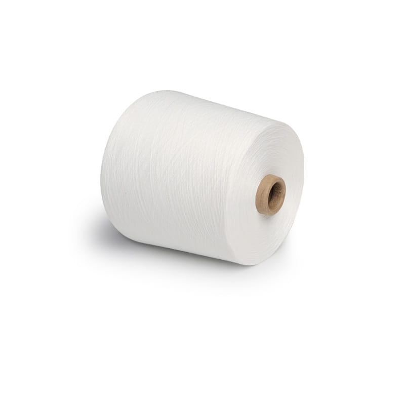 White spool of thread on a brown cardboard core, rolled into a cylinder
