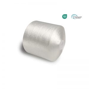 Silver spool of metallic thread on a white background with OEKO-TEX and Global Recycled Standard logos in the corner