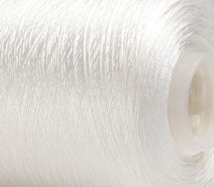 Close-up of white thread wound around a plastic spool, viewed from the side.