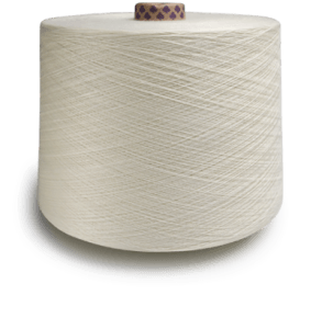 Large cream-colored spool of thread on a gray surface, viewed from the side