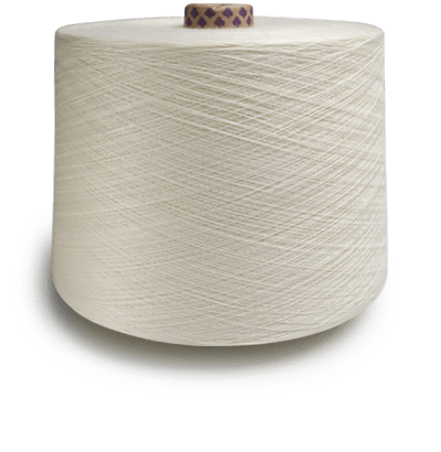 Large cream-colored spool of thread on a gray surface, viewed from the side